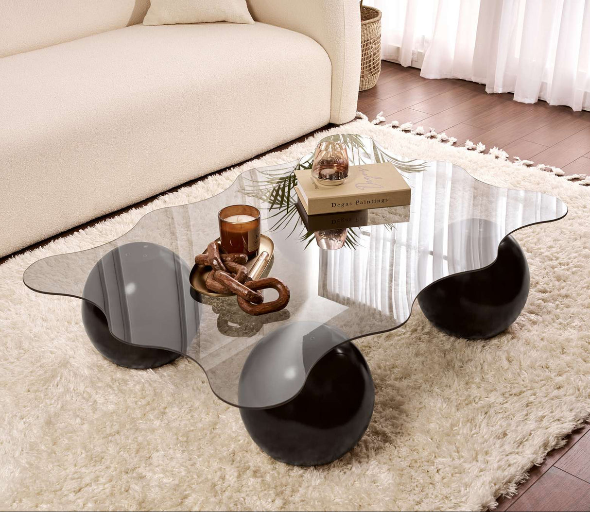 Golvende salontafel grijs getint glas zwarte bolpoten Noxa 120x80 cm